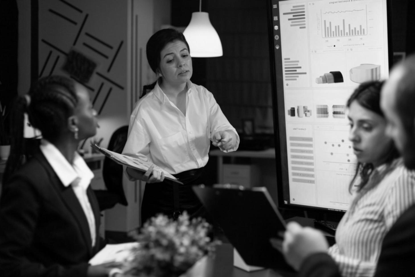 Financial planning consultation session with documents and laptop